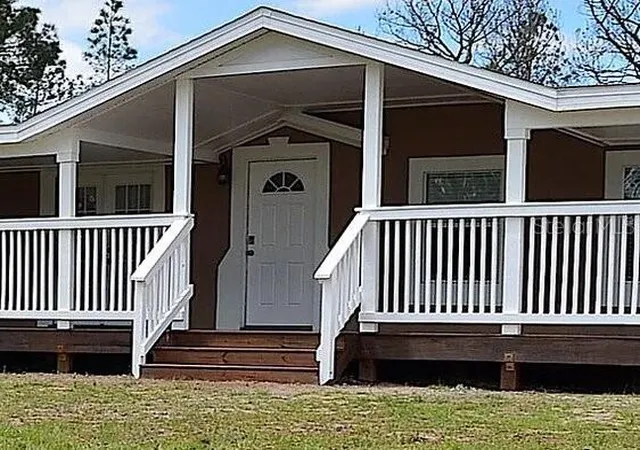 Photo 3 of Manufactured home for sale at 307 Country World Dr W, Davenport, FL 33897 | MLS# O6439437 | Listing updated on 2026-10-08