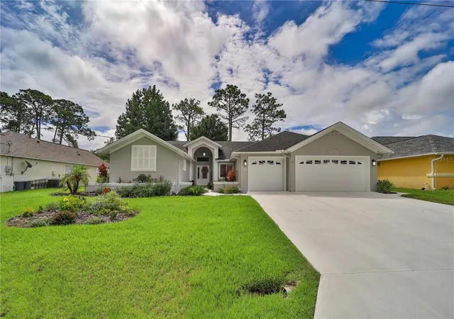 Photo 2 of Single family home for sale at 112 Ne Wellstone Dr, Palm Coast, FL 32164 | MLS# FC321257 | Listing updated on 2026-09-08