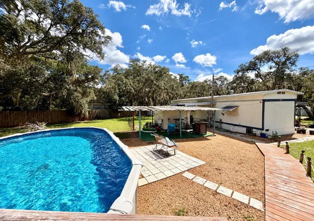 Photo 2 of Manufactured home for sale at 19049 Se 16th Place, Silver Springs, FL 34488 | MLS# OM731828 | Listing updated on 2026-09-07