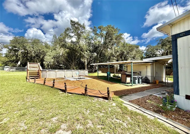 Photo 3 of Manufactured home for sale at 19049 SE 16th Place, Silver Springs, FL 34488 | MLS# OM731828 | Listing updated on 2026-09-07