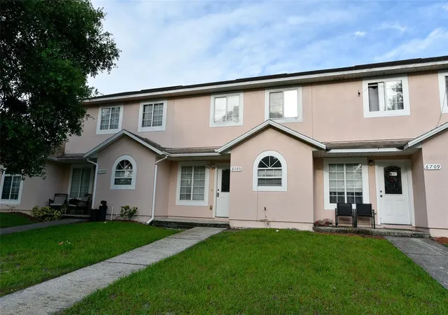 Photo 1 of Townhouse for sale at 6705 Magnolia Pointe Cir, Orlando, FL 32810 | MLS# O6439890 | Listing updated on 2026-09-08