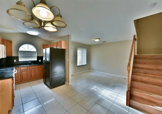 Photo 3 of Townhouse for sale at 6705 Magnolia Pointe Cir, Orlando, FL 32810 | MLS# O6439890 | Listing updated on 2026-09-08