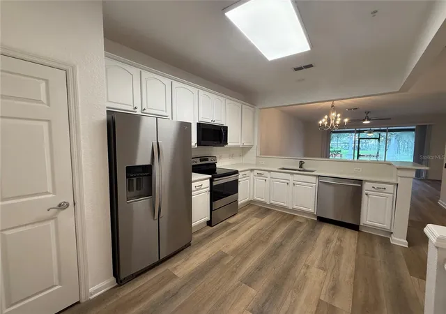 Photo 3 of Townhouse for sale at 7014 Cadiz Blvd, Orlando, FL 32819 | MLS# O6439906 | Listing updated on 2026-09-08
