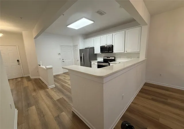 Photo 4 of Townhouse for sale at 7014 Cadiz Blvd, Orlando, FL 32819 | MLS# O6439906 | Listing updated on 2026-09-08