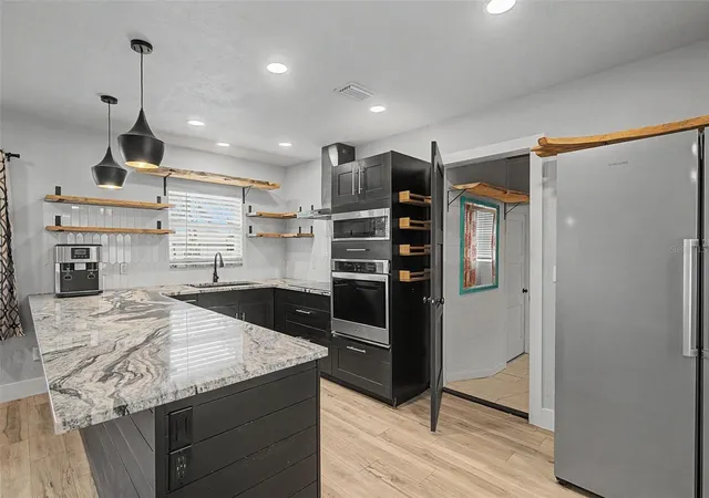 Photo 3 of Single family home for sale at 1304 Parkwood St, Clearwater, FL 33755 | MLS# TB8546448 | Listing updated on 2026-09-21