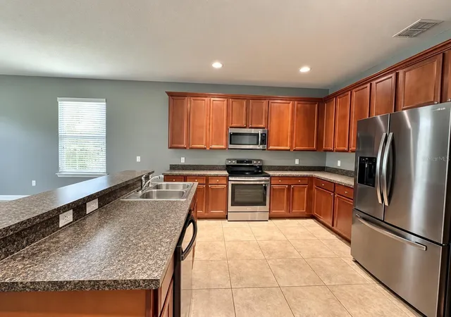 Photo 2 of Single family home for sale at 13303 Moss Park Ridge Dr, Orlando, FL 32832 | MLS# O6440010 | Listing updated on 2026-10-17