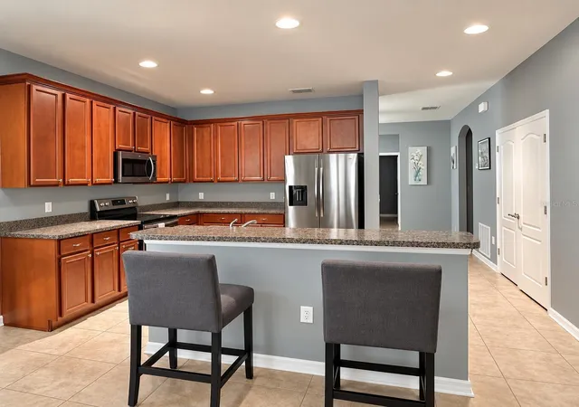 Photo 3 of Single family home for sale at 13303 Moss Park Ridge Dr, Orlando, FL 32832 | MLS# O6440010 | Listing updated on 2026-10-17