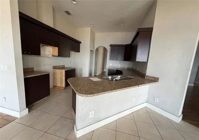 Photo 3 of Single family home for sale at 14639 Grand Cvs Dr, Orlando, FL 32837 | MLS# O6440272 | Listing updated on 2026-10-30