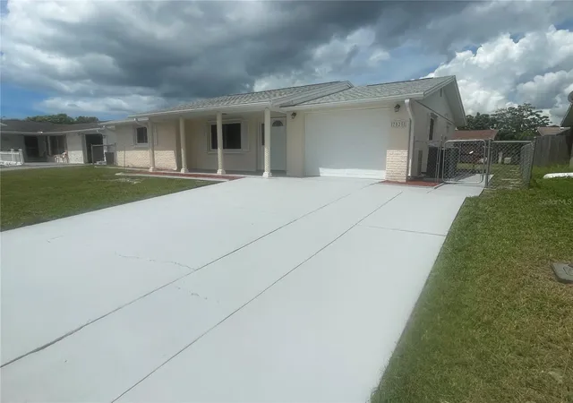 Photo 2 of Single family home for sale at 7025 Cutty Sark Dr, Port Richey, FL 34668 | MLS# W7889331 | Listing updated on 2026-10-04