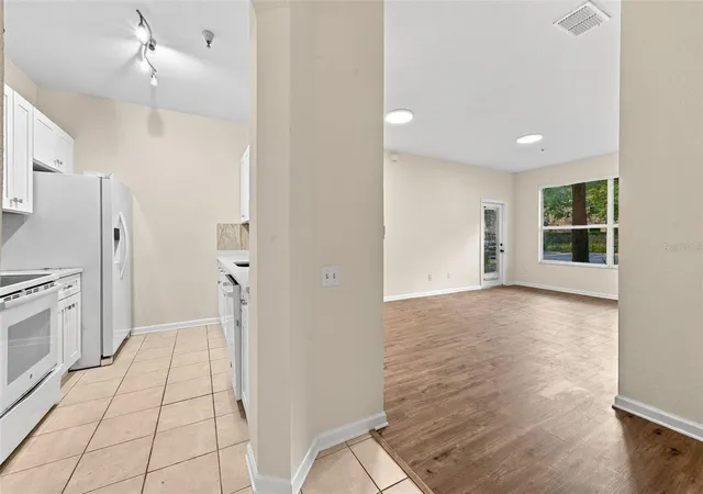Photo 3 of Condo for sale at 7135 Yacht Basin Ave #211, Orlando, FL 32835 | MLS# O6440343 | Listing updated on 2026-09-24