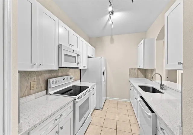 Photo 3 of Condo for sale at 7135 Yacht Basin Ave #211, Orlando, FL 32835 | MLS# O6440343 | Listing updated on 2026-09-24