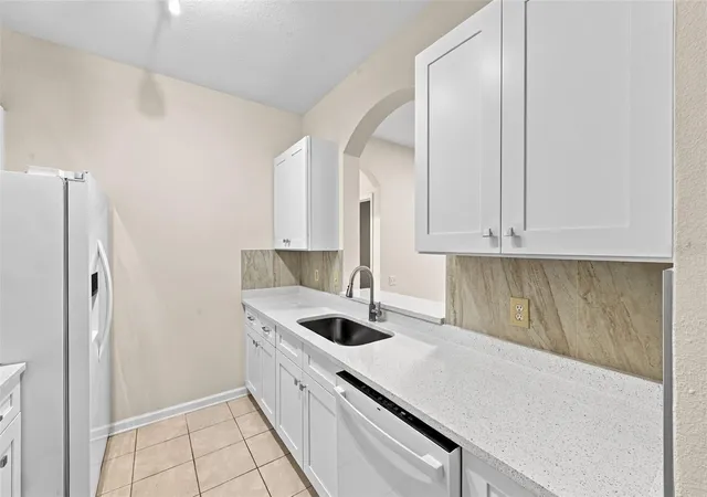 Photo 4 of Condo for sale at 7135 Yacht Basin Ave #211, Orlando, FL 32835 | MLS# O6440343 | Listing updated on 2026-09-24