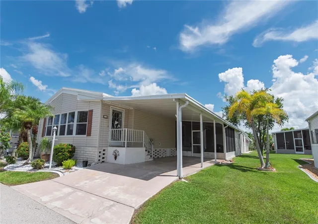 Photo 1 of Manufactured home for sale at 14 Holland Dr, Punta Gorda, FL 33950 | MLS# C7530553 | Listing updated on 2026-09-14