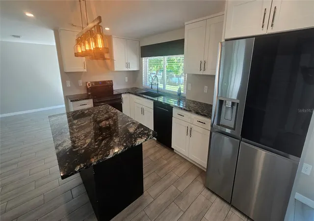 Photo 4 of Single family home for sale at 3532 Overland Dr, Holiday, FL 34691 | MLS# TB8547590 | Listing updated on 2026-10-07