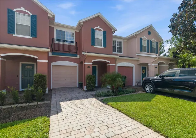 Photo 1 of Townhouse for sale at 933 Pine Pointe Ln, Orlando, FL 32828 | MLS# O6441240 | Listing updated on 2026-10-01
