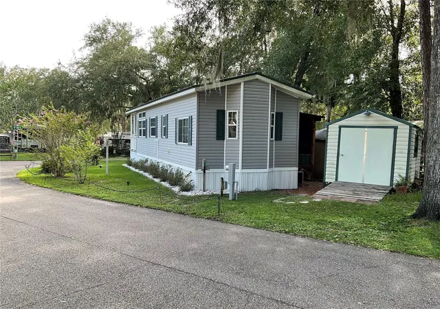 Photo 3 of Manufactured home for sale at 25349 140th Place NE, Fort Mc Coy, FL 32134 | MLS# OM732147 | Listing updated on 2026-09-26