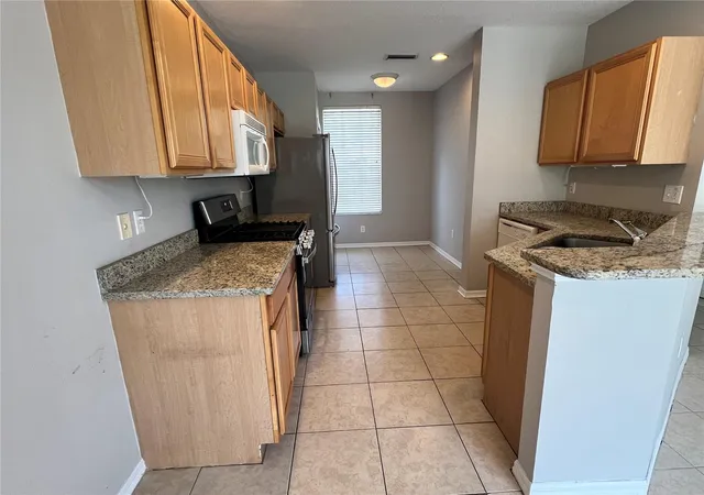 Photo 3 of Townhouse for sale at 10008 Tate Ln, Tampa, FL 33626 | MLS# TB8548144 | Listing updated on 2026-09-19