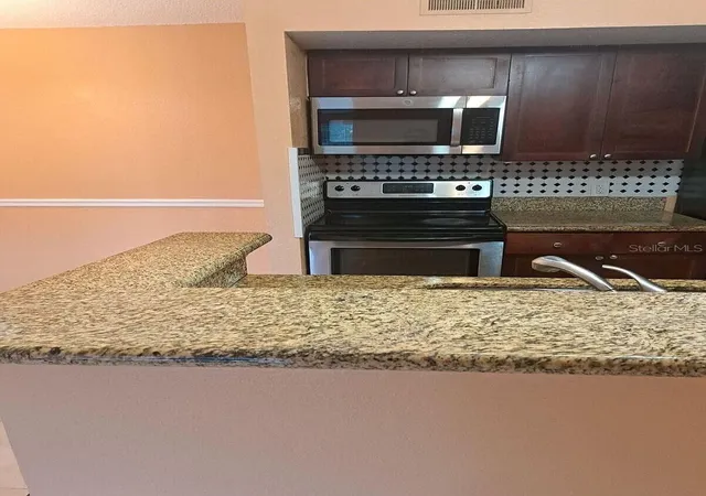 Photo 2 of Condo for sale at 5160 Conroy Rd #1435, Orlando, FL 32811 | MLS# O6441645 | Listing updated on 2026-09-19