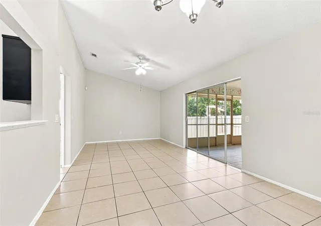 Photo 3 of Single family home for sale at 7720 Lakeside Woods Dr, Orlando, FL 32810 | MLS# O6441808 | Listing updated on 2026-09-17