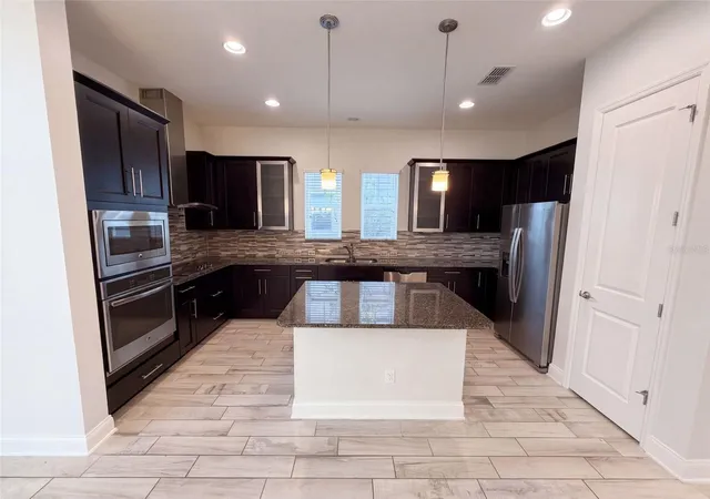 Photo 2 of Single family home for sale at 7797 Laureate Blvd, Orlando, FL 32827 | MLS# O6442009 | Listing updated on 2026-10-08