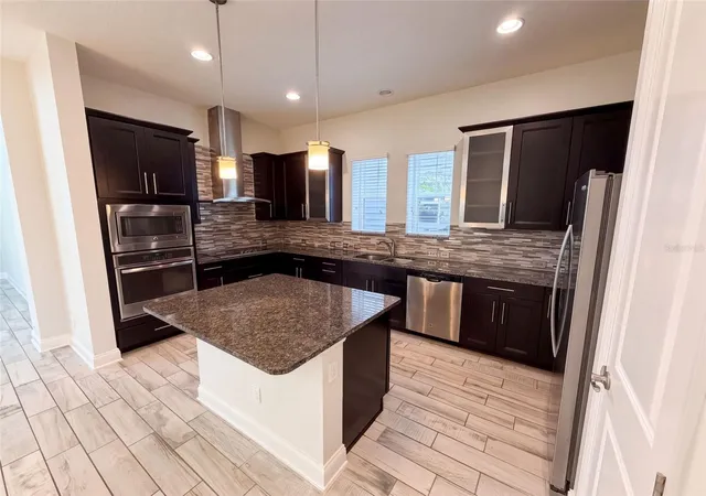 Photo 3 of Single family home for sale at 7797 Laureate Blvd, Orlando, FL 32827 | MLS# O6442009 | Listing updated on 2026-10-08