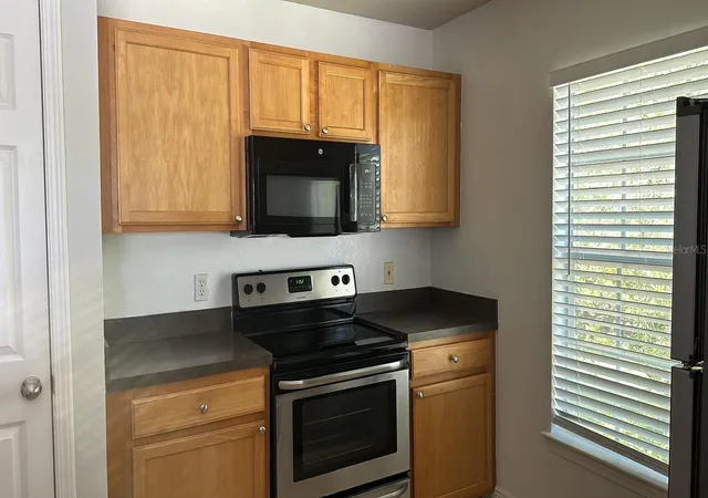 Listing Photo 4 - Condo for sale in building located at 9149 Lee Vis Blvd, Orlando, FL 32829 - Unit #405