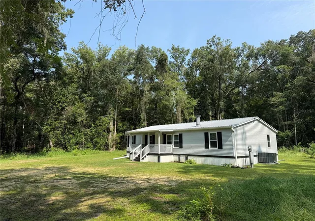 Photo 1 of Manufactured home for sale at 12051 Nw 7th Place, Ocala, FL 34482 | MLS# OM732329 | Listing updated on 2026-10-07