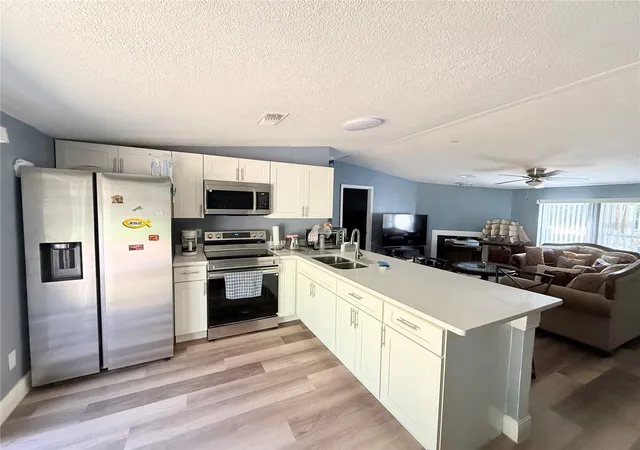 Photo 3 of Manufactured home for sale at 12051 NW 7th Place, Ocala, FL 34482 | MLS# OM732329 | Listing updated on 2026-10-07