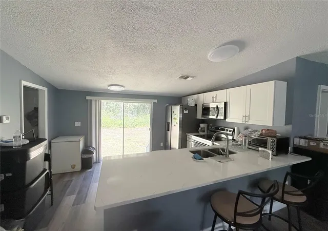 Photo 4 of Manufactured home for sale at 12051 NW 7th Place, Ocala, FL 34482 | MLS# OM732329 | Listing updated on 2026-10-07