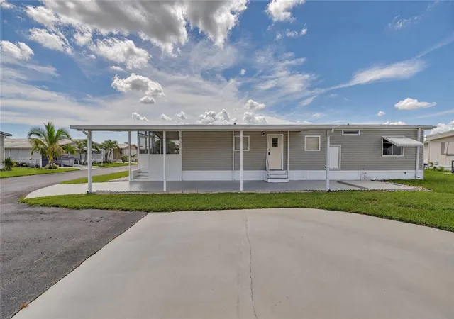 Photo 2 of Manufactured home for sale at 52008 Florinada, Boynton Beach, FL 33436 | MLS# O6442152 | Listing updated on 2026-09-17