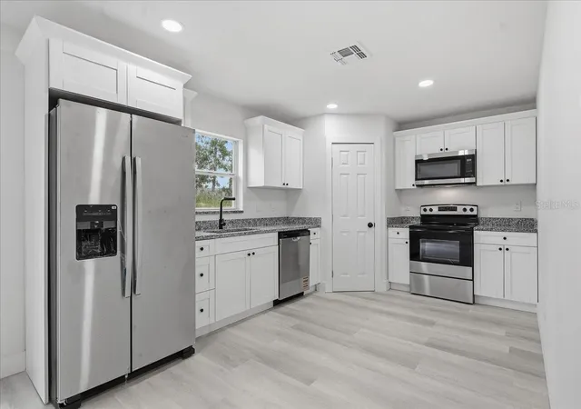 Photo 3 of Single family home for sale at 12493 Killian St, Spring Hill, FL 34609 | MLS# TB8549045 | Listing updated on 2026-09-16