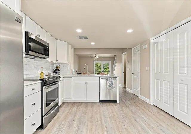 Photo 3 of Townhouse for sale at 1202 Brigadoon Dr, Clearwater, FL 33759 | MLS# TB8549419 | Listing updated on 2026-09-18
