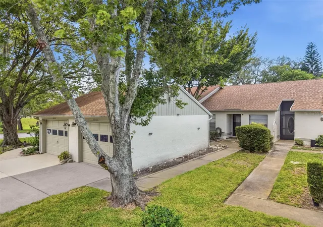 Photo 2 of Single family home for sale at 11715 Spring Tree Ln, Port Richey, FL 34668 | MLS# TB8549576 | Listing updated on 2026-09-19