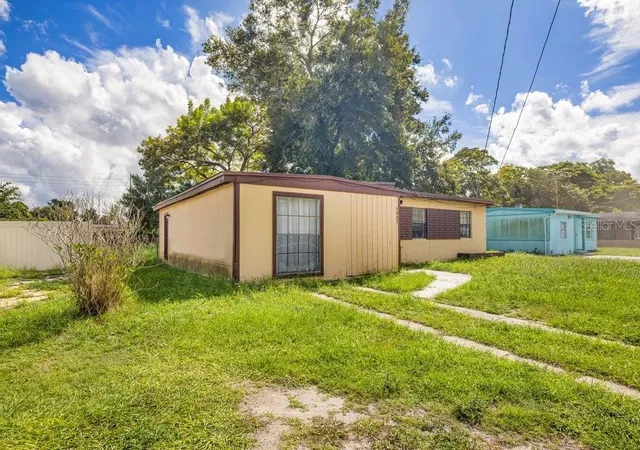 Photo 2 of Single family home for sale at 1227 N Pine Hills Rd, Orlando, FL 32808 | MLS# O6442808 | Listing updated on 2026-09-26