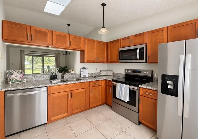 Listing Photo 1 - Condo for sale in building located at 9911 Lancewood St SE, ORLANDO, FL 32817