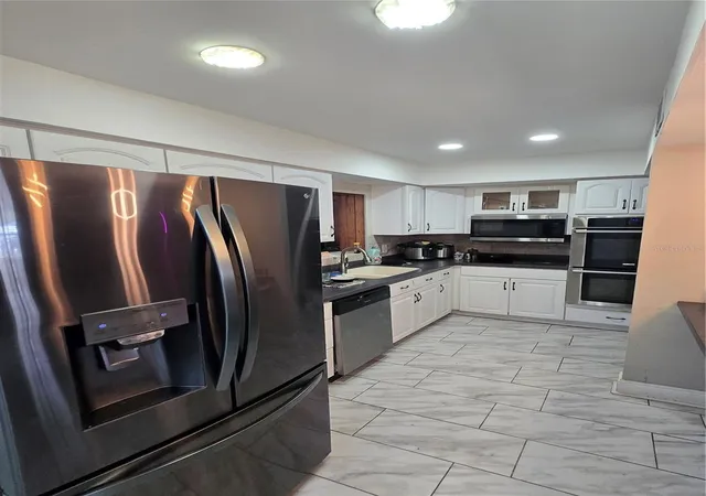 Photo 4 of Single family home for sale at 7710 W Hanna Ave, Tampa, FL 33615 | MLS# TB8549858 | Listing updated on 2026-10-03
