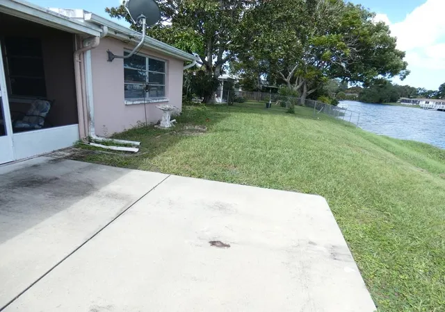 Photo 3 of Single family home for sale at 7207 Ashwood Dr, Port Richey, FL 34668 | MLS# W7889634 | Listing updated on 2026-09-19