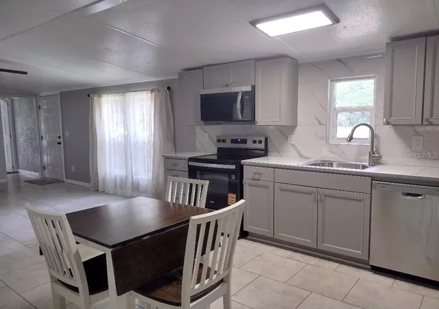 Photo 3 of Manufactured home for sale at 4055 Mahogany Blvd, Bunnell, FL 32110 | MLS# FC321561 | Listing updated on 2026-09-19
