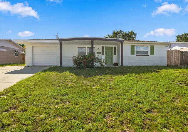 Photo 1 of Single family home for sale at 1031 Classic Dr, Holiday, FL 34691 | MLS# W7889642 | Listing updated on 2026-10-09
