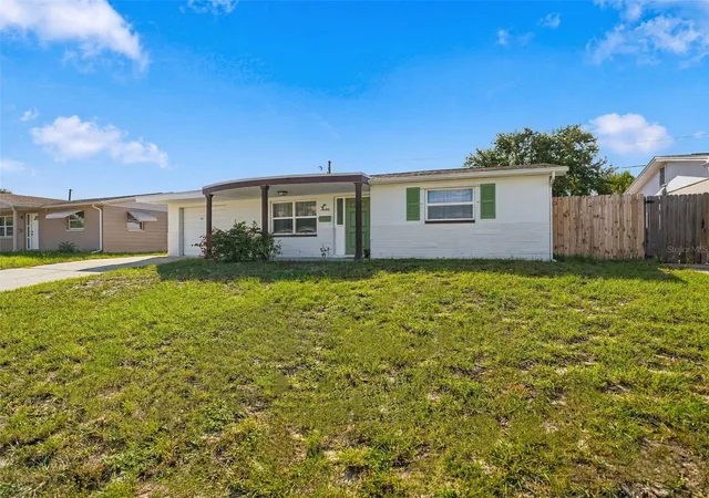 Photo 3 of Single family home for sale at 1031 Classic Dr, Holiday, FL 34691 | MLS# W7889642 | Listing updated on 2026-10-09