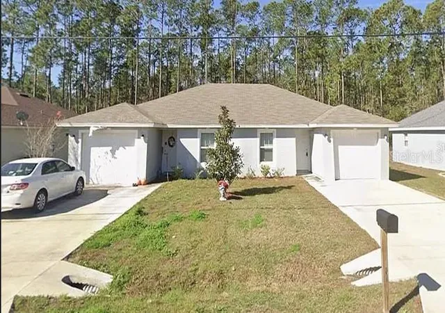 Photo 1 of Multi family home for sale at 26 Riddle Dr, Palm Coast, FL 32164 | MLS# OM732566 | Listing updated on 2026-09-20