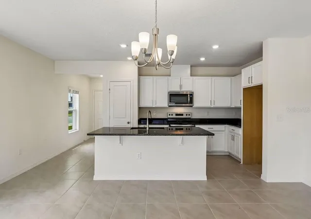 Photo 2 of Townhouse for sale at 627 Meadows Edge Pl, Lake Wales, FL 33859 | MLS# O6443298 | Listing updated on 2026-10-06