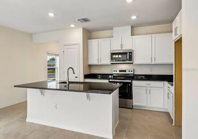 Photo 3 of Townhouse for sale at 627 Meadows Edge Pl, Lake Wales, FL 33859 | MLS# O6443298 | Listing updated on 2026-10-06