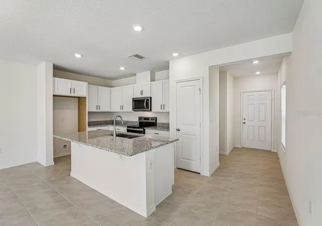 Photo 2 of Townhouse for sale at 647 Meadows Edge Pl, Lake Wales, FL 33859 | MLS# O6443305 | Listing updated on 2026-10-06