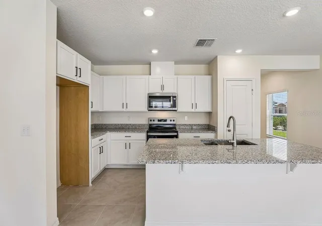 Photo 3 of Townhouse for sale at 647 Meadows Edge Pl, Lake Wales, FL 33859 | MLS# O6443305 | Listing updated on 2026-10-06