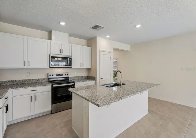 Photo 3 of Townhouse for sale at 647 Meadows Edge Pl, Lake Wales, FL 33859 | MLS# O6443305 | Listing updated on 2026-10-06