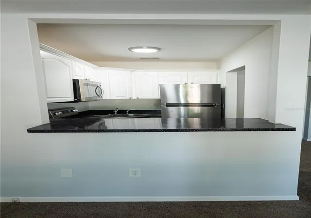 Photo 4 of Condo for sale at 1257 Drew St #14, Clearwater, FL 33755 | MLS# TB8550388 | Listing updated on 2026-10-06