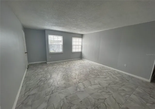 Photo 3 of Condo for sale at 2755 L B Mcleod Rd #2755C, Orlando, FL 32805 | MLS# O6443410 | Listing updated on 2026-09-24