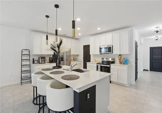 Photo 4 of Single family home for sale at 4307 Pebbles Throw Dr, Kissimmee, FL 34746 | MLS# O6443461 | Listing updated on 2026-09-26