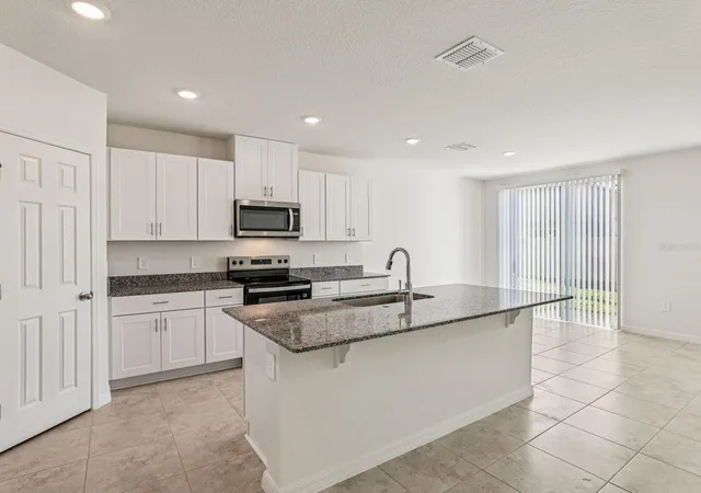 Photo 3 of Single family home for sale at 1377 Oak Valley Dr, Auburndale, FL 33823 | MLS# TB8550564 | Listing updated on 2026-10-02